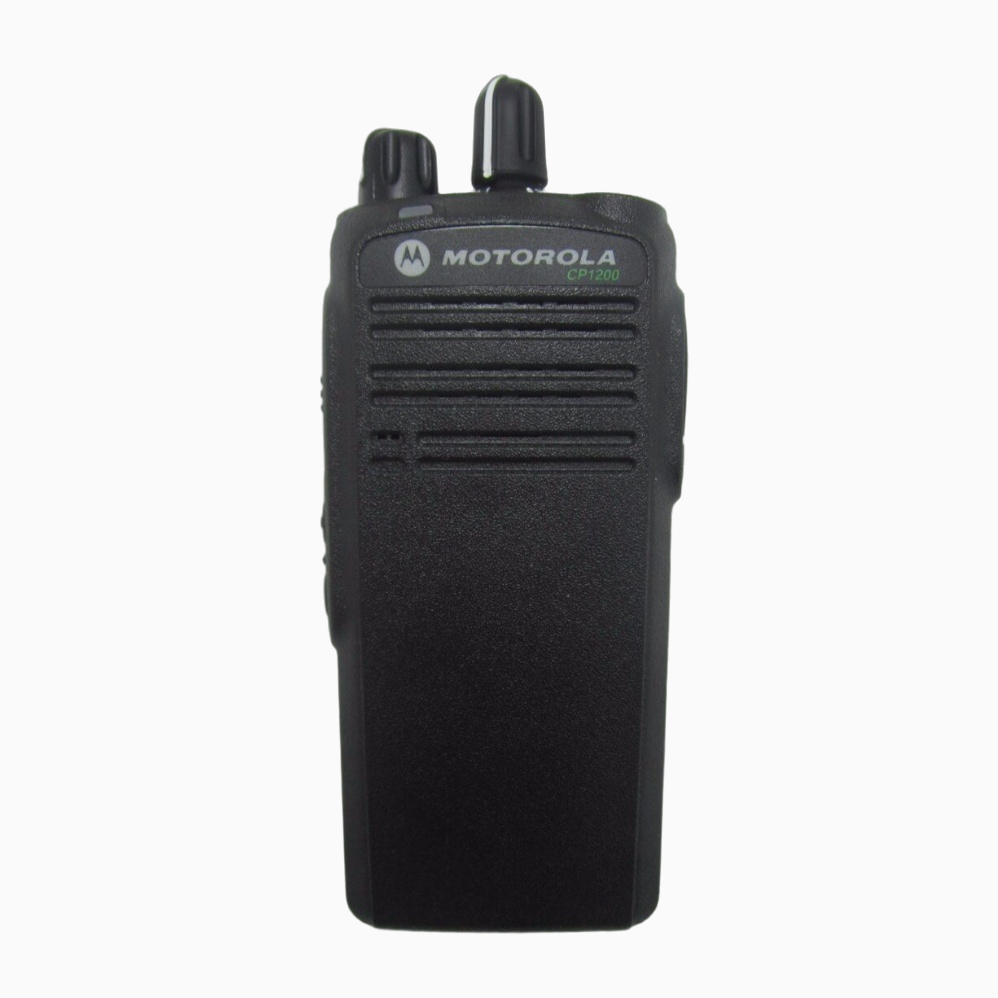 Retail security officer wearing Motorola CP1200 analog radio in surveillance mode with discreet earpiece during floor patrol