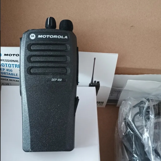 Motorola DEP450 radio side and back view showing rugged housing, belt clip, 4W VHF UHF labeling and battery release
