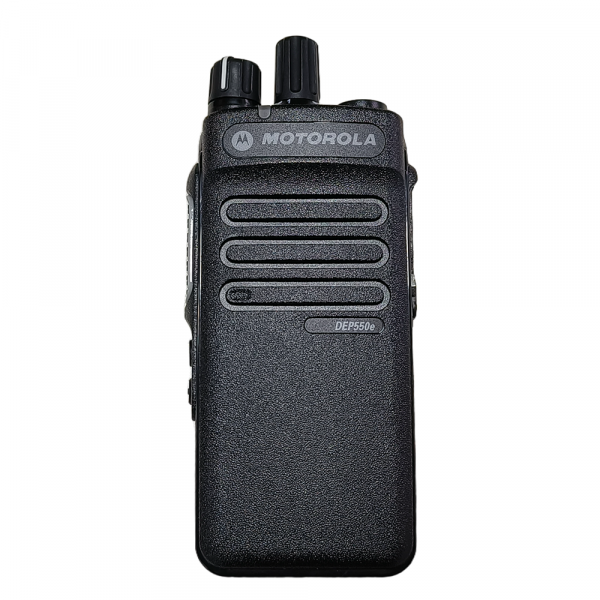 Port operations supervisor using Motorola DEP550E radio with Bluetooth earpiece on rain-soaked dock during loading operations