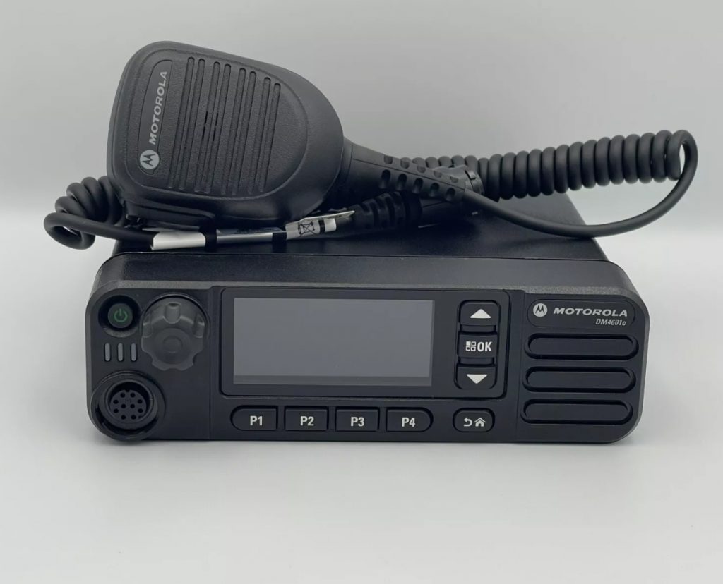 Motorola DM4601E mobile radio back panel showing IP67 sealed ports, 50W power rating, mounting bracket and antenna connector