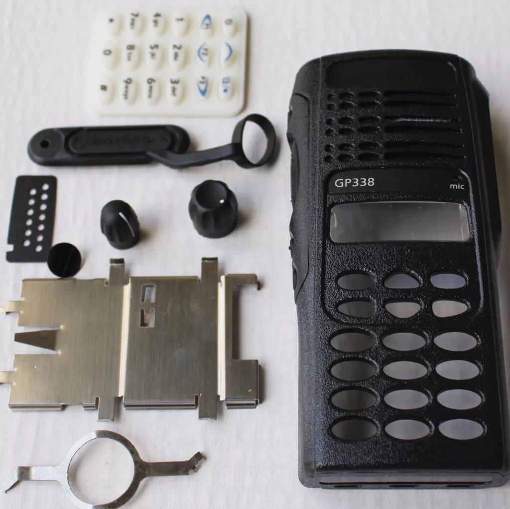 Motorola PMLN4199 housing showing black green red color options, full keypad openings and speaker grille for GP338 HT1250