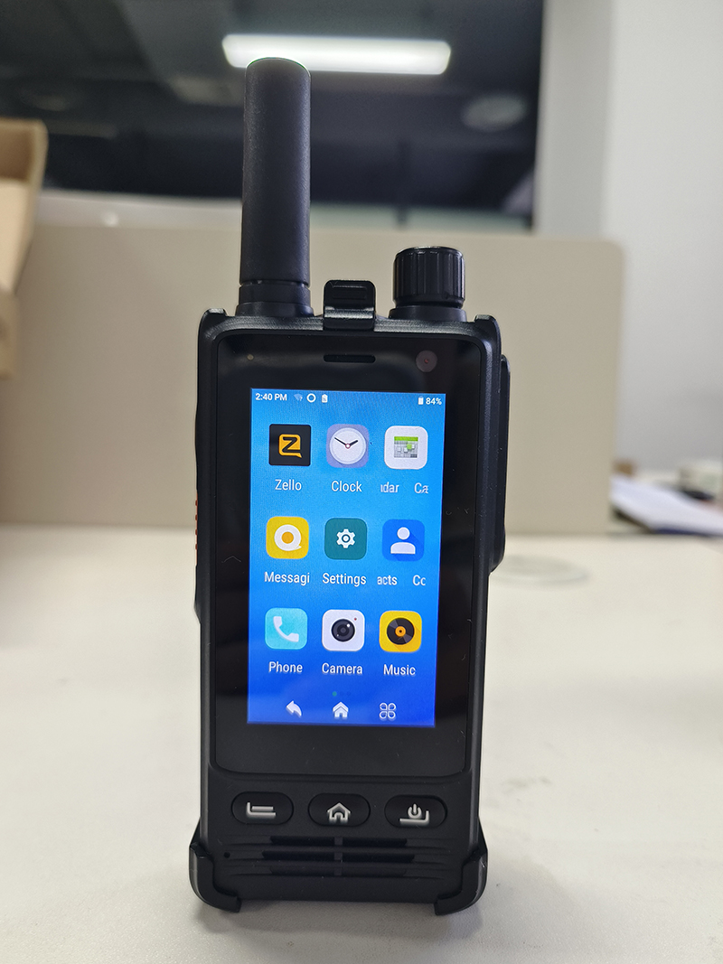 Security patrol officer using W33 4G PoC radio on Android Zello app to coordinate guards across a site over 2G 3G 4G networ